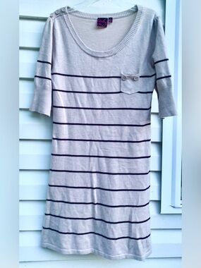 take out Beige Top with Black Tag and Pink Logo